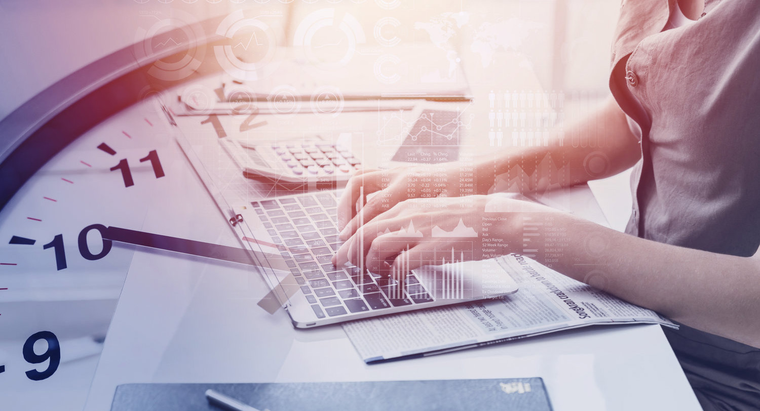 Woman typing on her laptop with a clock image overlay